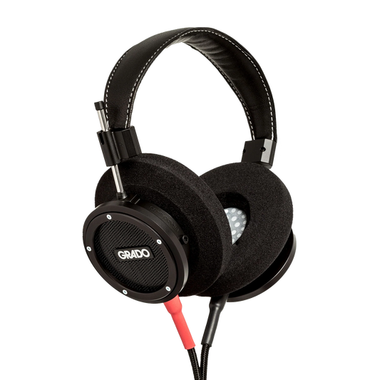 Photo of Grado S750 Headphones taken from the 3/4 view - the Grado logo is featured in the center of the ear cup and the red/black cables can be seen coming out of the headphone.