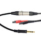Sideways close up of Grado Gold Detachable audio Cables on a white background. The plugs are red and black. The red plug has a white R on it and the black plug has a white L on it.
