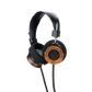 Photo of Grado RS1 Headphones taken from the 3/4 view - One ear cup is facing down while the other ear cup is facing outward - the words - Grado Classic Series - and - RS1 - can be seen on the ear cup.