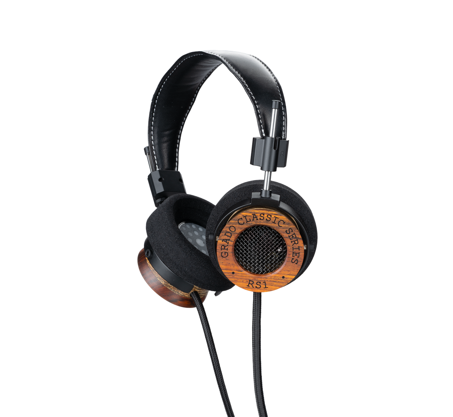 Photo of Grado RS1 Headphones taken from the 3/4 view - One ear cup is facing down while the other ear cup is facing outward - the words - Grado Classic Series - and - RS1 - can be seen on the ear cup.