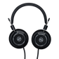 Photo of Grado SR60 Headphones  taken from the top - both the left and right ear cups can be seen and have the model name - SR60 - in the center - and - The Classic Series - and - Grado Labs - are written on the outer edge of the ear cups. The cables can be seen coming out of the headphone.