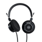 Photo of Grado SR60 Headphones  taken from 3/4 view - one ear cup is facing away from view while the other is showing the model name - SR60 - can be seen in the center and the words - The Classic Series - and - Grado Labs are written on the outside edge of the ear cups. The cables can be seen coming out of the headphone.