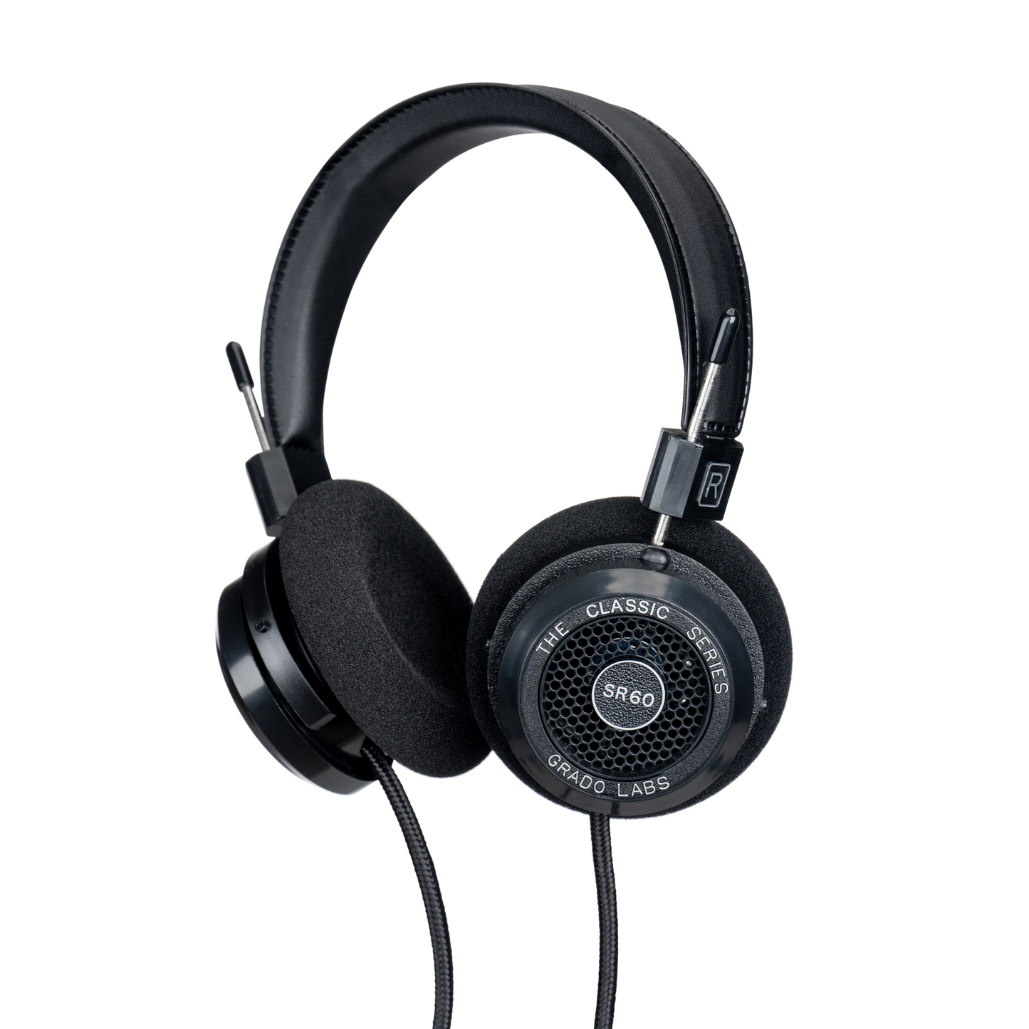 Photo of Grado SR60 Headphones  taken from 3/4 view - one ear cup is facing away from view while the other is showing the model name - SR60 - can be seen in the center and the words - The Classic Series - and - Grado Labs are written on the outside edge of the ear cups. The cables can be seen coming out of the headphone.