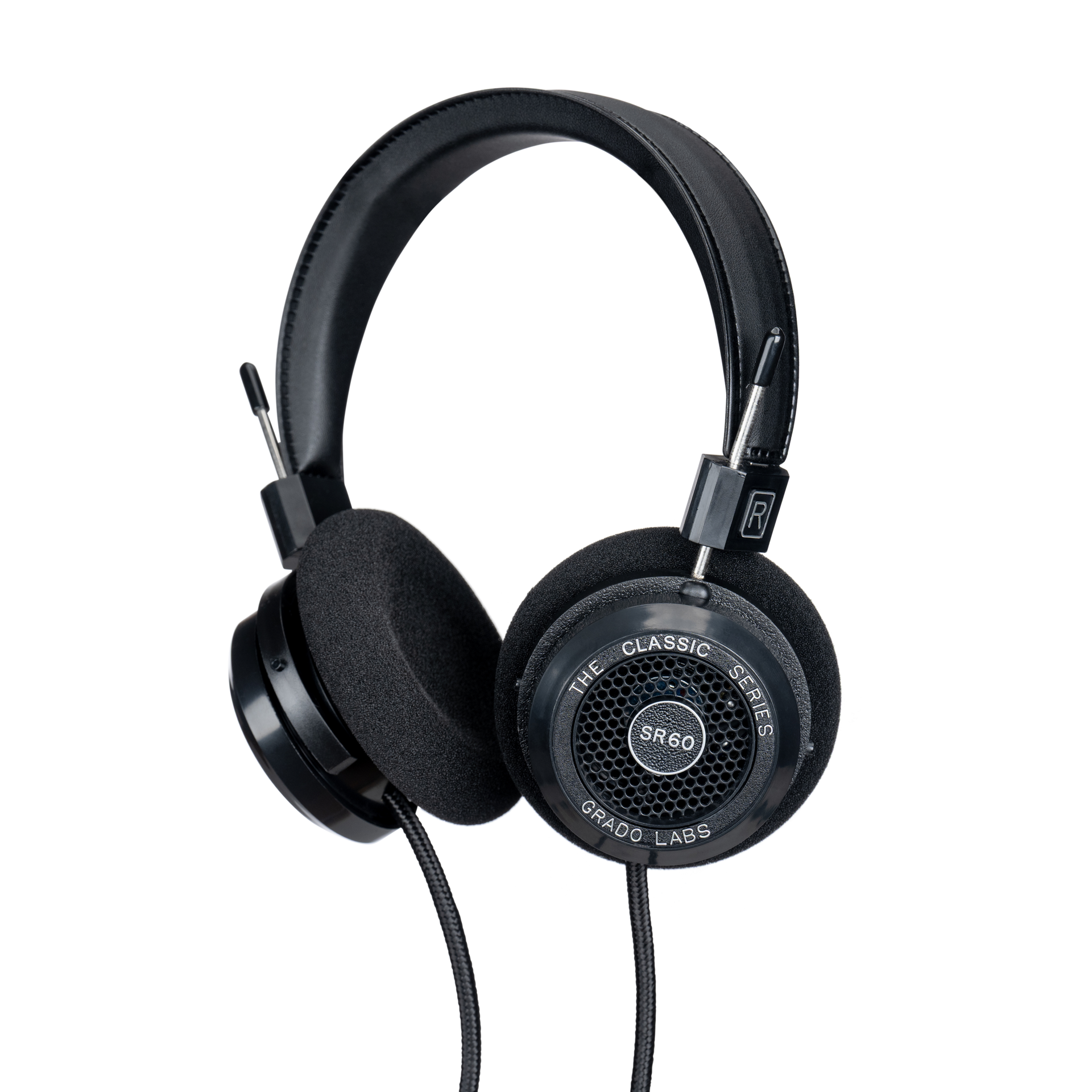 Photo of Grado SR60 Headphones  taken from 3/4 view - one ear cup is facing away from view while the other is showing the model name - SR60 - can be seen in the center and the words - The Classic Series - and - Grado Labs are written on the outside edge of the ear cups. The cables can be seen coming out of the headphone.