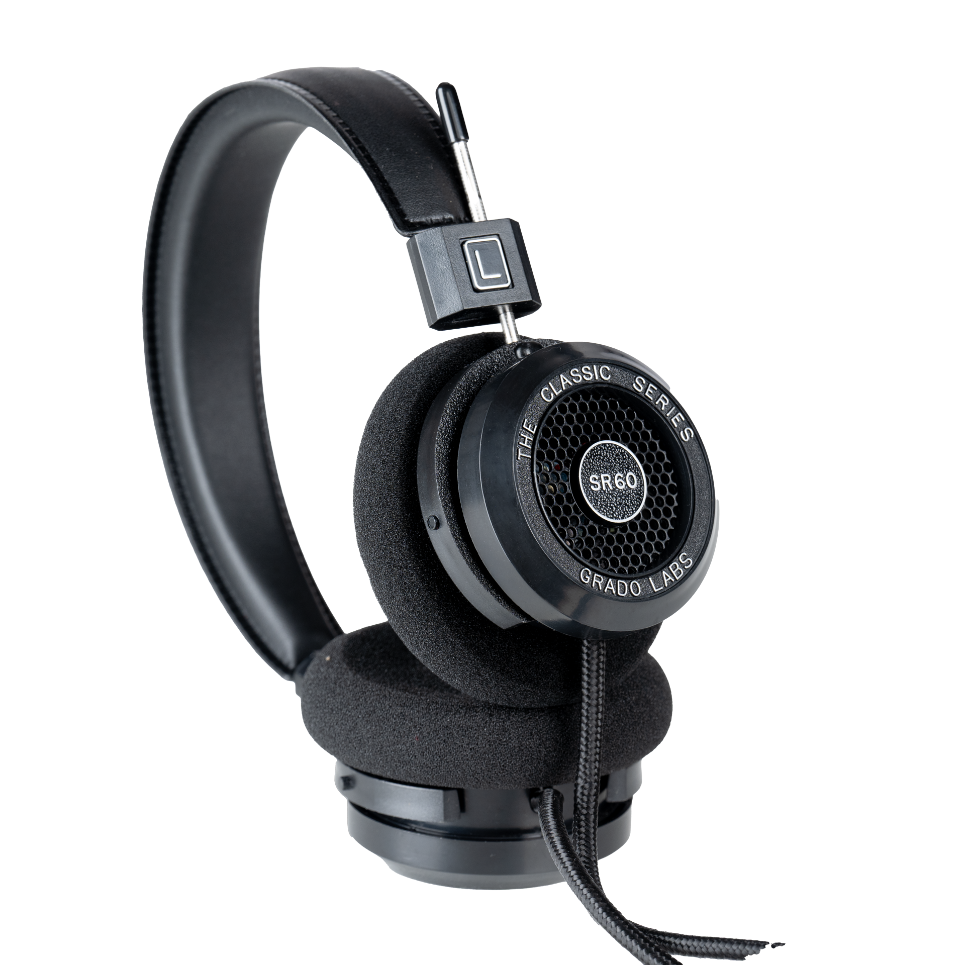 Photo of Grado SR60 Headphones taken from the 3/4 view - One ear cup is facing down while the other ear cup is facing outward - showing the model name in the center - SR60 - and the words - The Classic Series - and - Grado Labs - written along the edge of the ear cups.