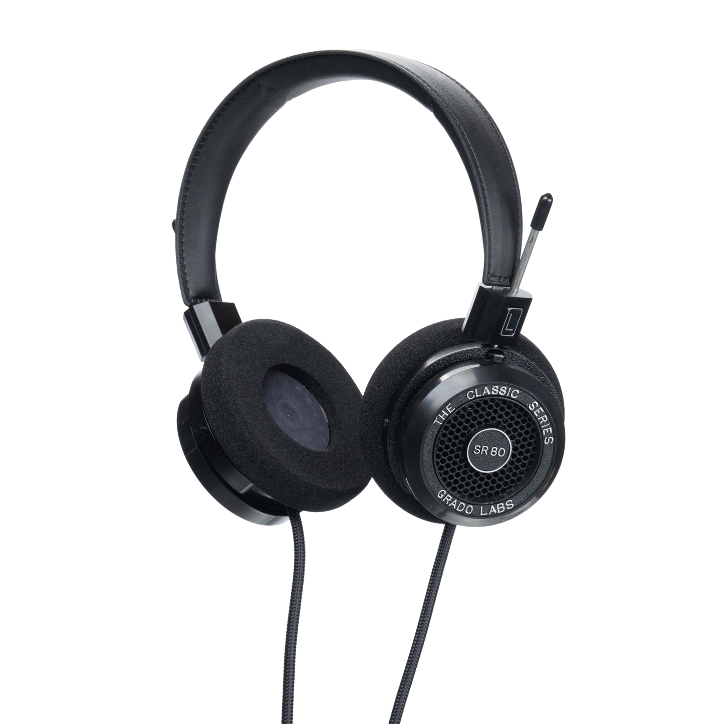 Photo of Grado SR80 Headphones  taken from 3/4 view - one ear cup is facing away from view while the other is showing the model name - SR80 - can be seen in the center and the words - The Classic Series - and - Grado Labs are written on the outside edge of the ear cups. The cables can be seen coming out of the headphone.