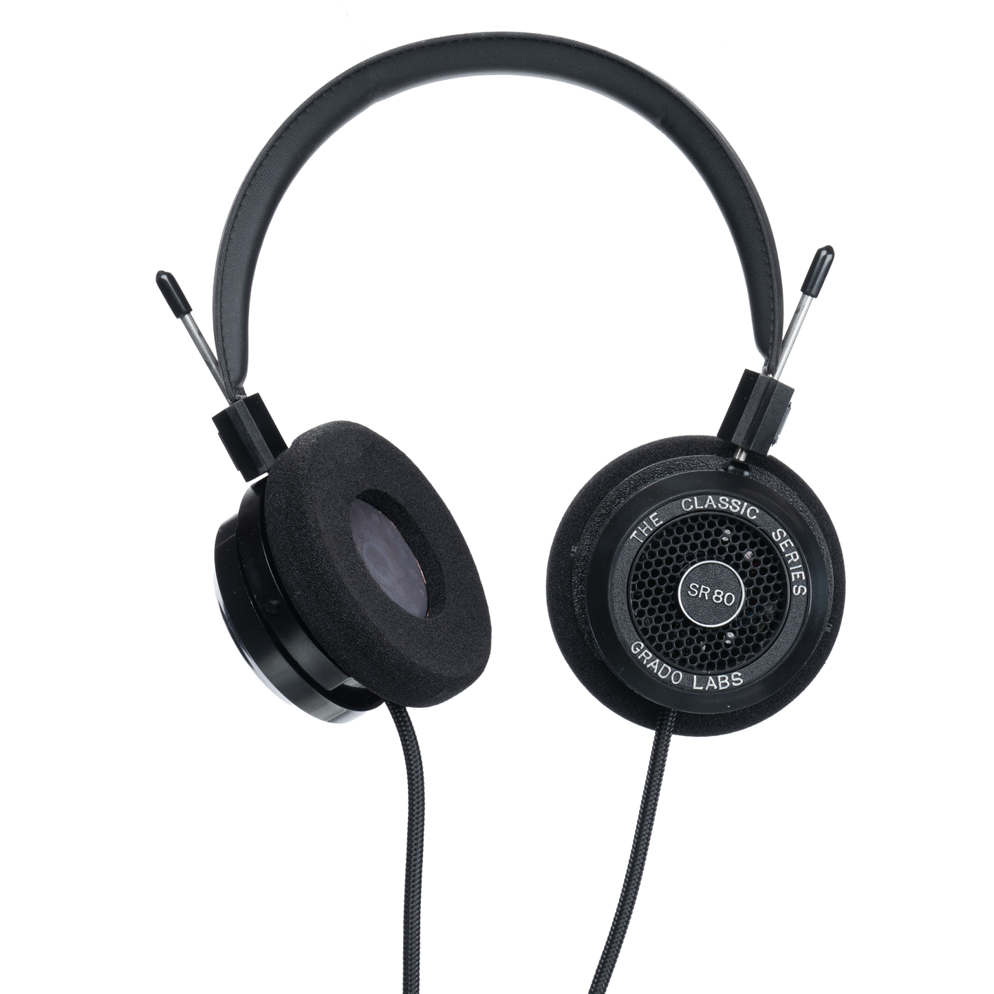 Photo of Grado SR80 Headphones  taken from 3/4 view - one ear cup is facing away from view while the other is showing the model name - SR80 - can be seen in the center and the words - The Classic Series - and - Grado Labs are written on the outside edge of the ear cups. The cables can be seen coming out of the headphone.