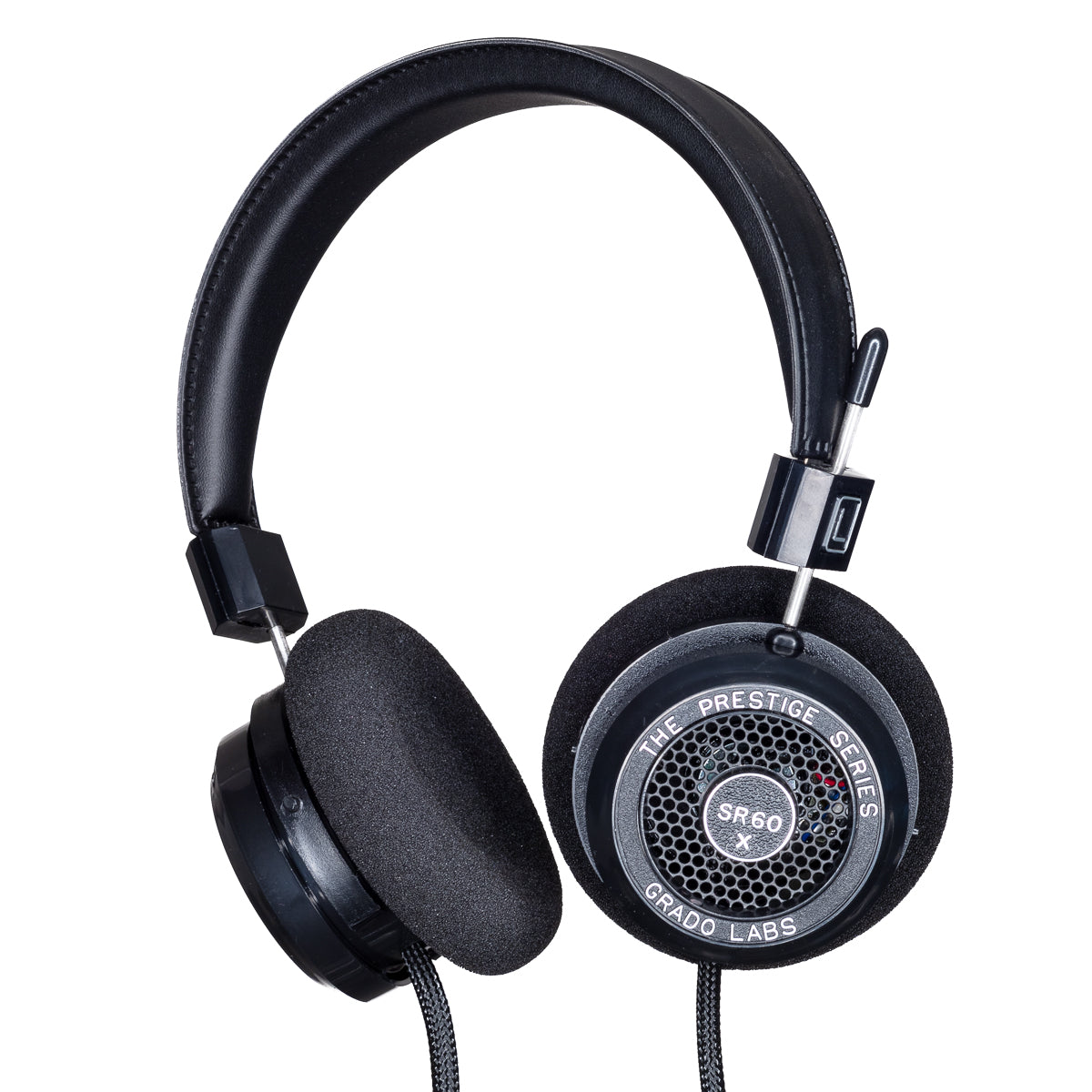 Photo of Grado SR60x Headphones  taken from 3/4 view - one ear cup is facing away from view while the other is showing the model name - SR60x - can be seen in the center and the words - The Prestige Series - and - Grado Labs are written on the outside edge of the ear cups. The cables can be seen coming out of the headphone.