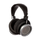Photo of Grado HP100SE Headphones  taken from 3/4 view - one ear cup is facing away from view while the other is showing the model name - Signature HP100 SE - and - Grado Labs are written on the outside edge of the ear cups. 