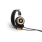 Photo of Grado Hemp Headphones taken from the 3/4 view - One ear cup is facing down while the other ear cup is facing outward - showing the Grado logo.