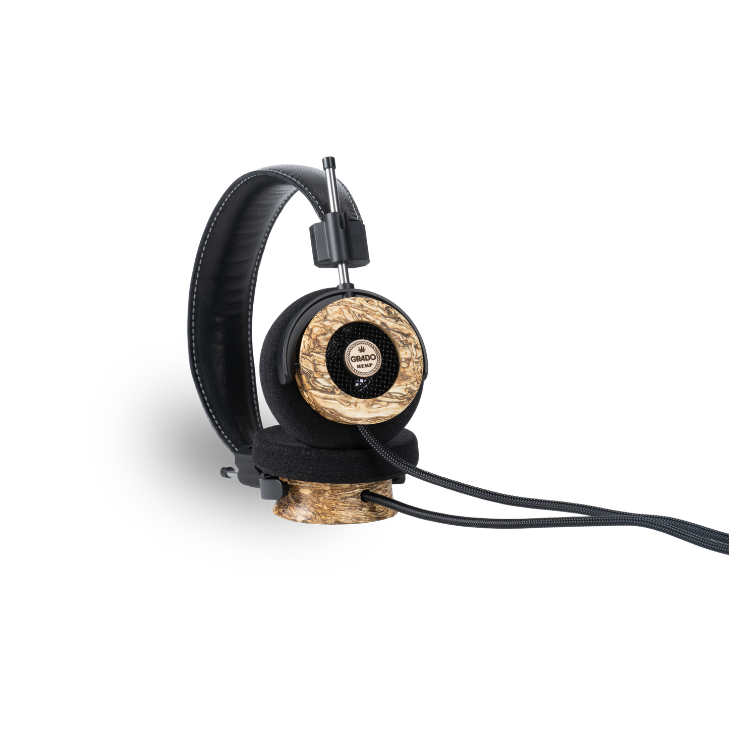 Photo of Grado Hemp Headphones taken from the 3/4 view - One ear cup is facing down while the other ear cup is facing outward - showing the Grado logo.