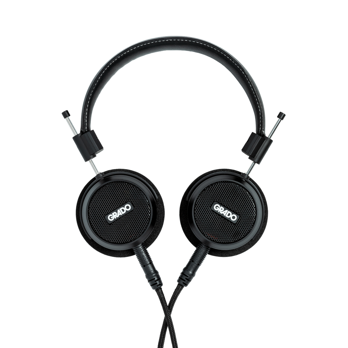 Photo of Grado S150 Headphones on a white background taken from the top - both the left and right ear cups can be seen and have the Grado logo in the center - the black cables can be seen coming out of the headphone.