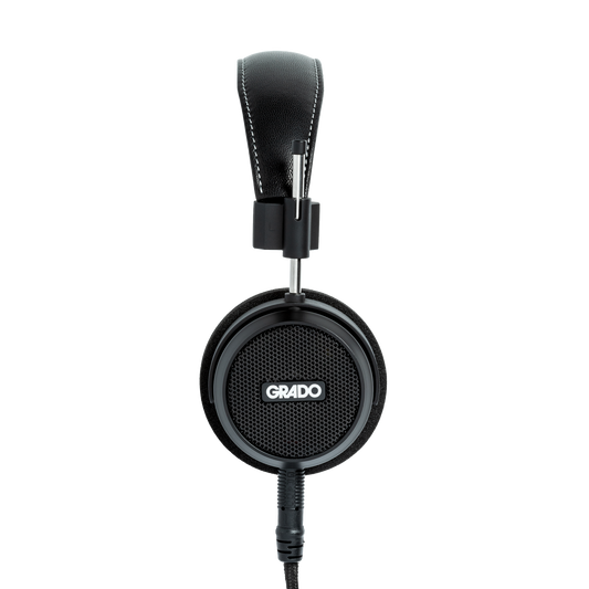 Photo of Grado S150 Headphones taken from the side - the Grado logo is featured in the center of the ear cup.
