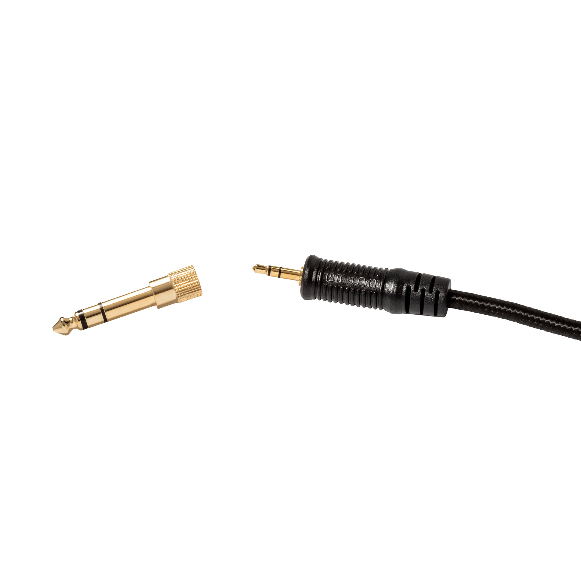 Photo of gold 3.5mm cable and 6.33mm adapter on a white background.