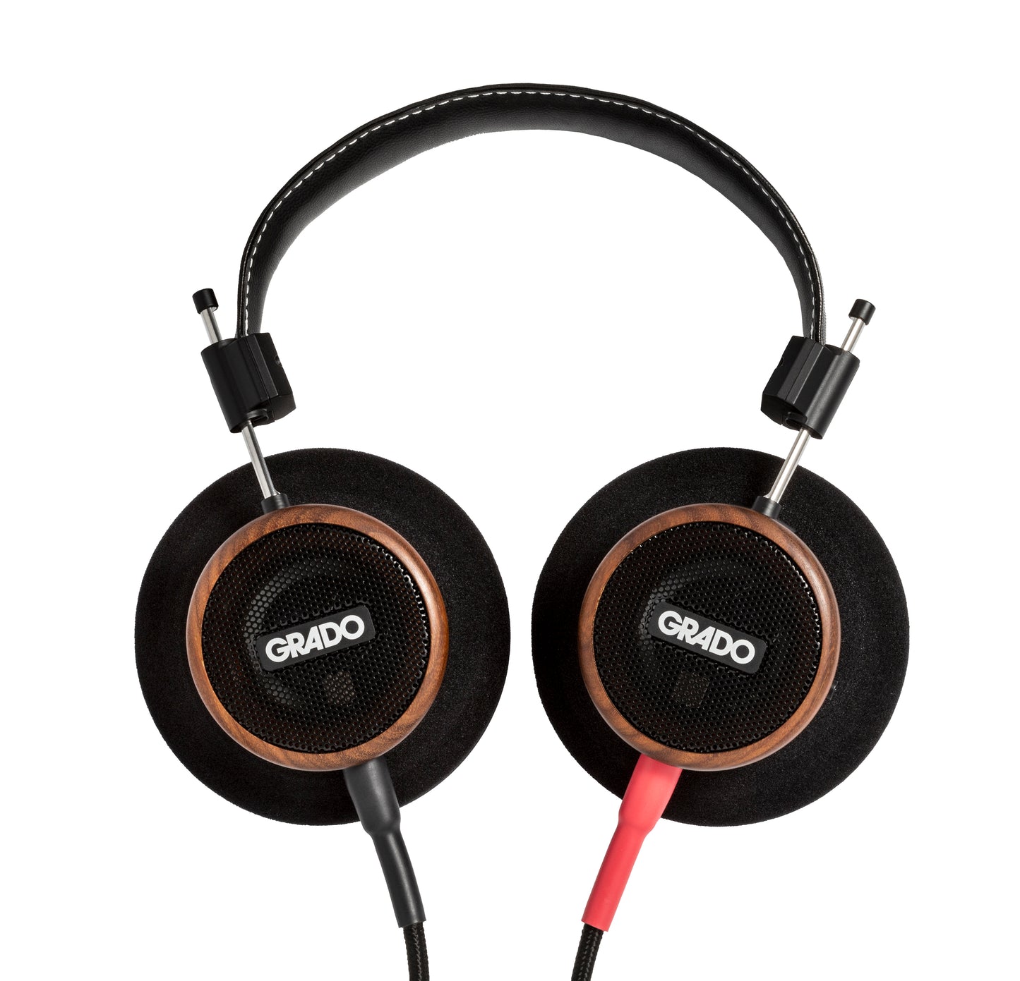 Photo of Grado S550 Headphones on a white background taken from the top - both the left and right ear cups can be seen and have the Grado logo in the center - the red/black cables can be seen coming out of the headphone.