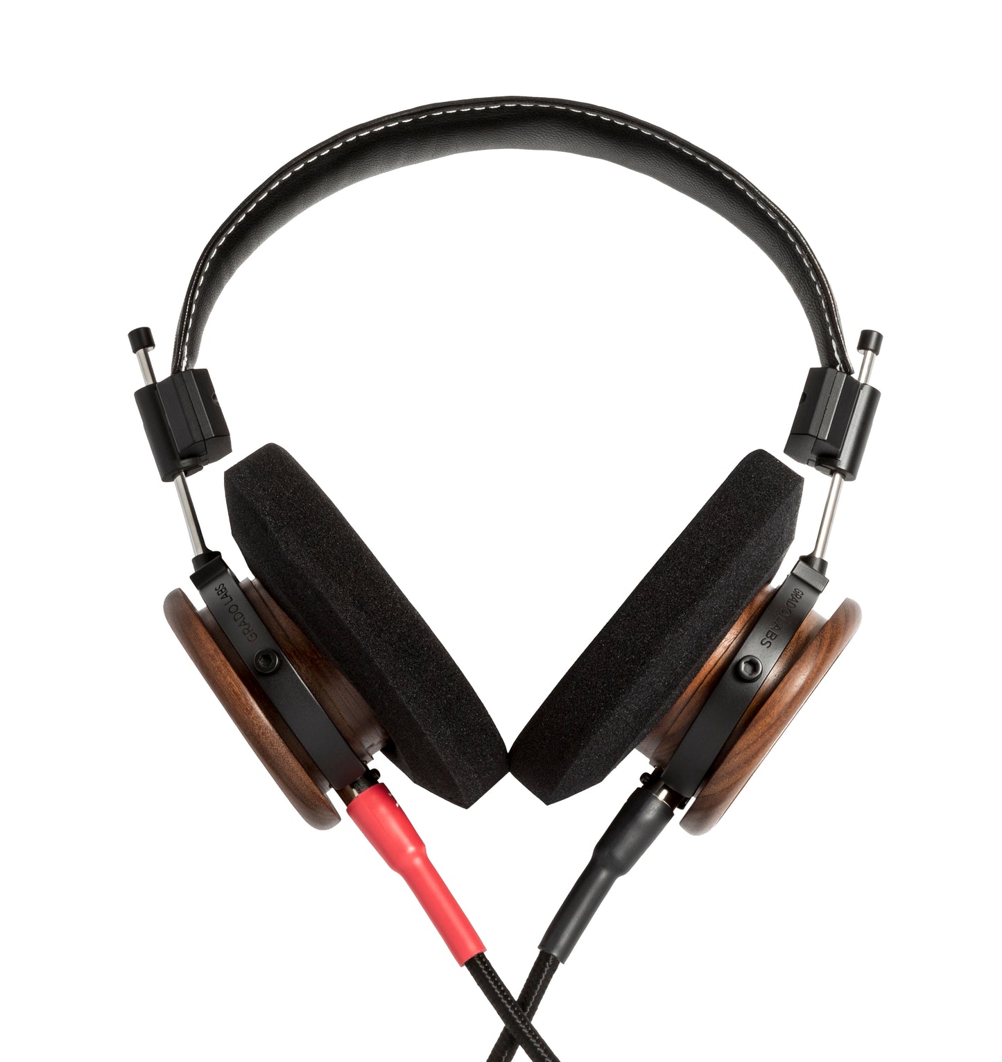 Photo of Grado S550 Headphones on a white background taken from the back - the red/black cables can be seen coming out of the headphone.
