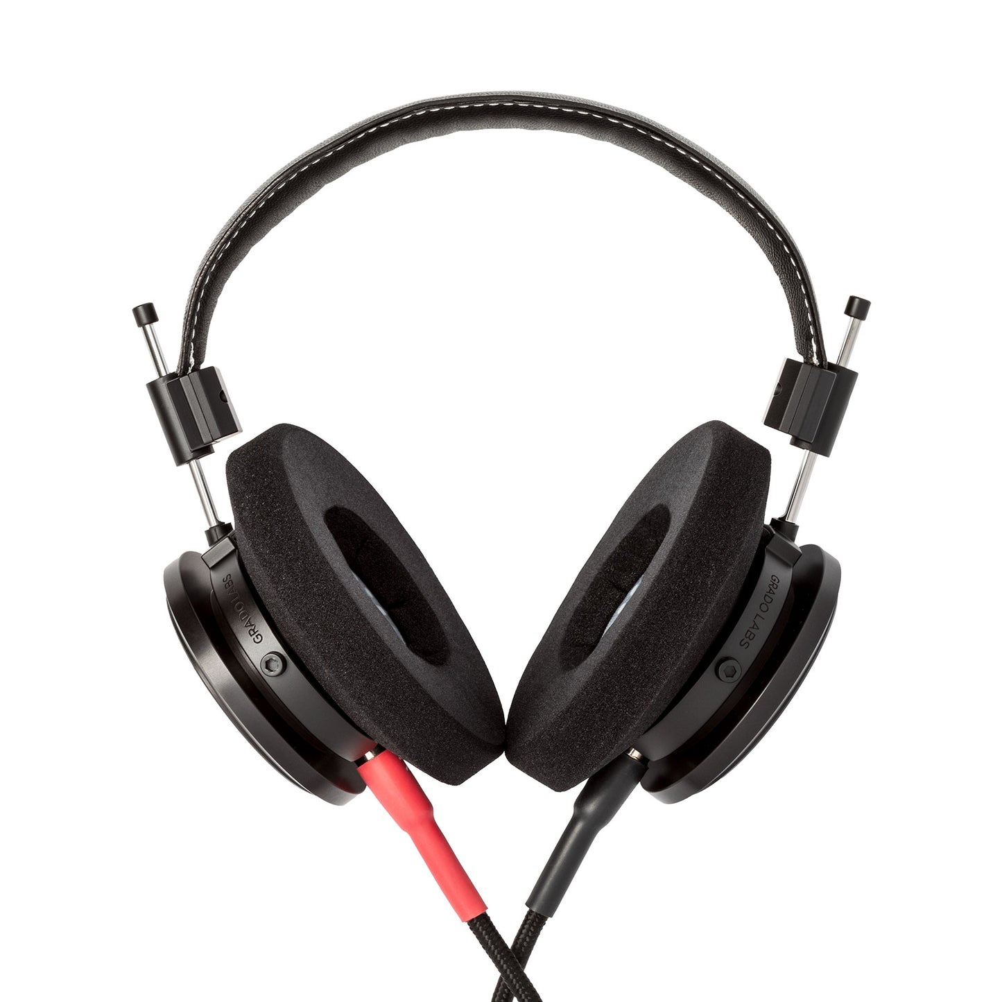 Photo of Grado S750 Headphones on a white background taken from the back - the red/black cables can be seen coming out of the headphone.