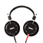 Photo of Grado S750 Headphones on a white background taken from the top - both the left and right ear cups can be seen and have the Grado logo in the center - the red/black cables can be seen coming out of the headphone.