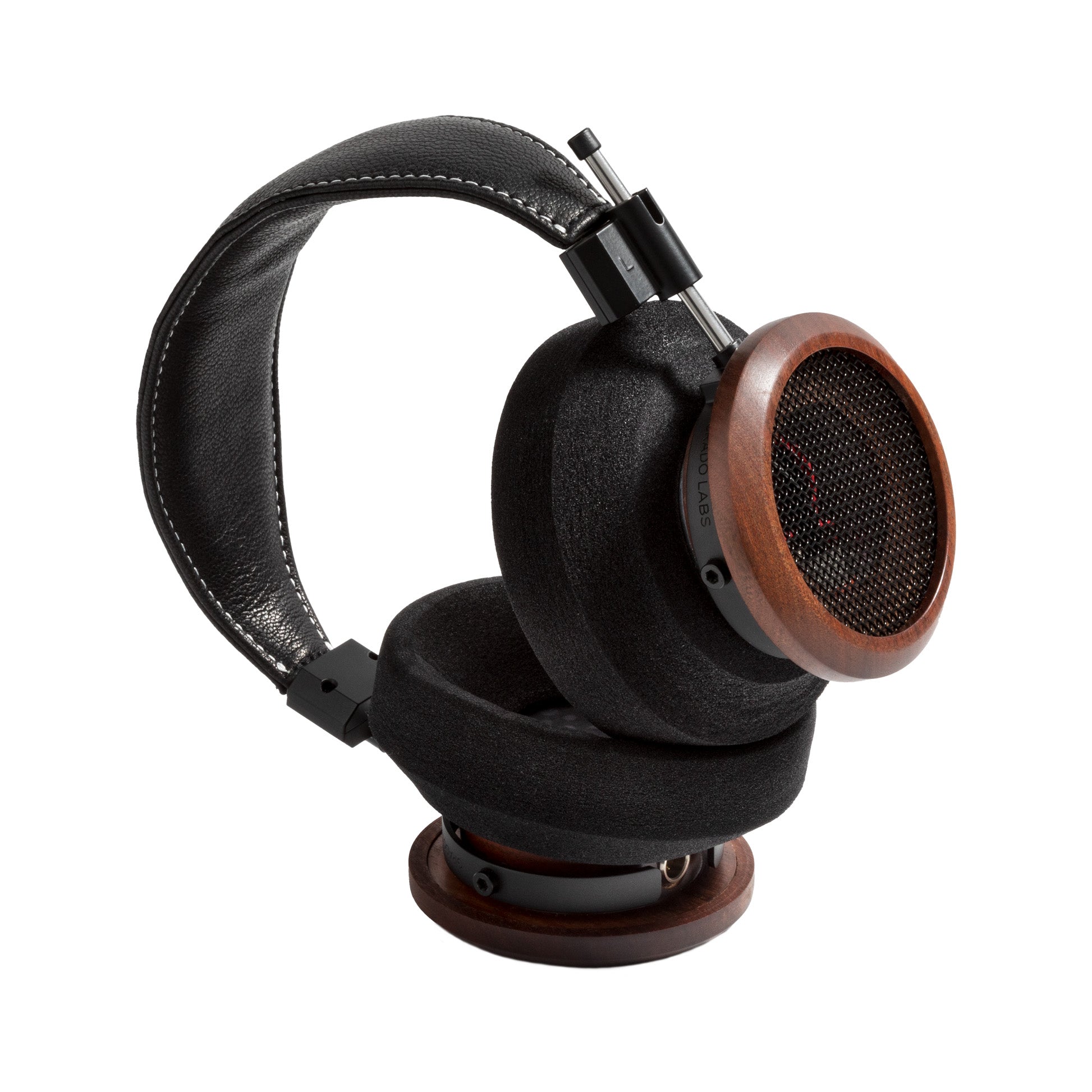 3/4 view photo of the Grado S950 Headphones taken on a white background. One ear cup is facing down while the other ear cup is facing to the side.