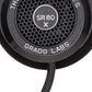 Close up photo of the Grado SR80x Headphones taken from the side - the model name - SR80x - is featured in the center of the ear cup. The Words - The Prestige Series - and - Grado Labs are written around the outer edge of the ear cup.