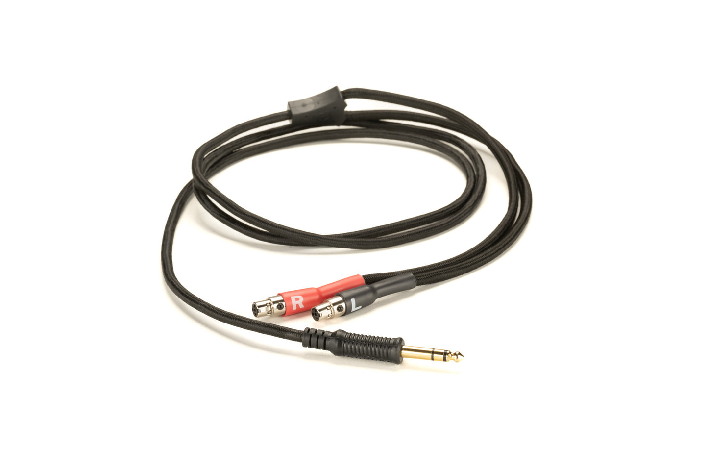 Close up of Grado Gold Detachable audio Cables on a white background. The cable is coiled around itself. The plugs are red and black. The red plug has a white R on it and the black plug has a white L on it. T