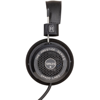 Photo of the Grado SR125x Headphones taken from the side - the model name - SR125x - is featured in the center of the ear cup. The Words - The Prestige Series - and - Grado Labs are written around the outer edge of the ear cup.