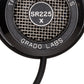 Close up photo of the Grado SR225x Headphones taken from the side - the model name - SR225x - is featured in the center of the ear cup. The Words - The Prestige Series - and - Grado Labs are written around the outer edge of the ear cup.