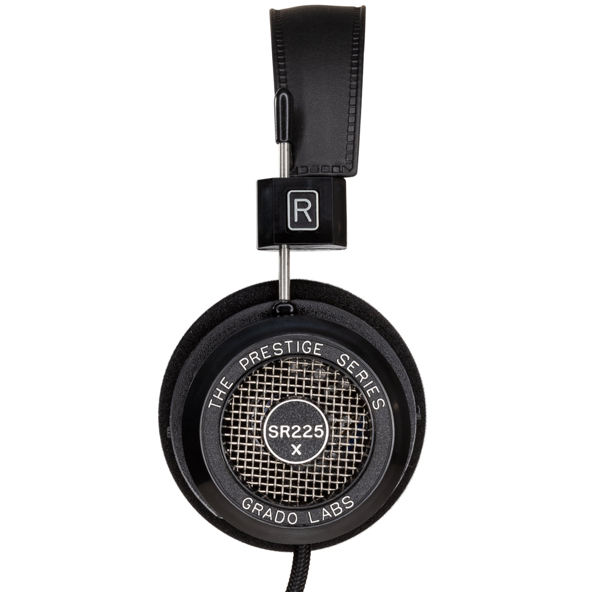 Photo of the Grado SR225x Headphones taken from the side - the model name - SR225x - is featured in the center of the ear cup. The Words - The Prestige Series - and - Grado Labs are written around the outer edge of the ear cup.