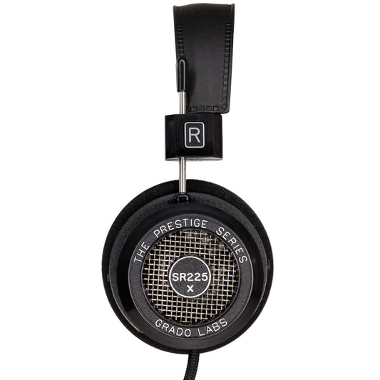 Photo of the Grado SR225x Headphones taken from the side - the model name - SR225x - is featured in the center of the ear cup. The Words - The Prestige Series - and - Grado Labs are written around the outer edge of the ear cup.